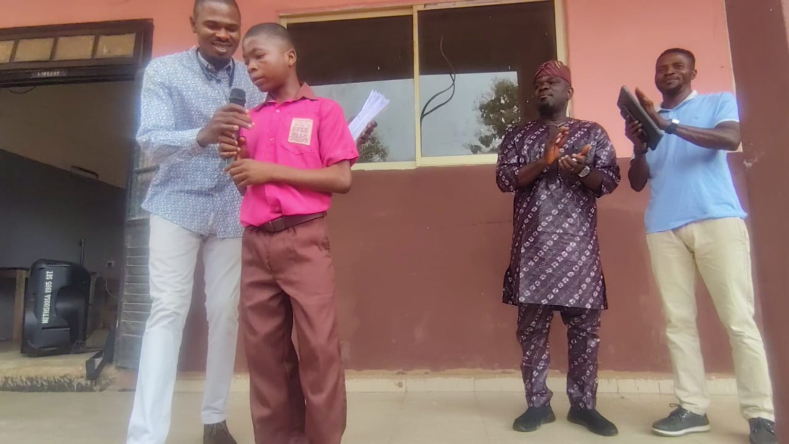 A student speaking to the school community